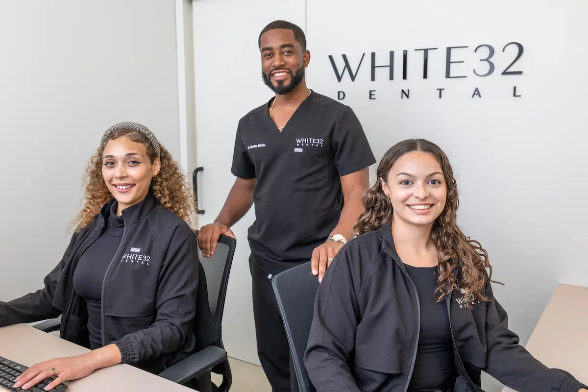 The White32 Dental team at the front desk in Foxhall Square, Suite 323