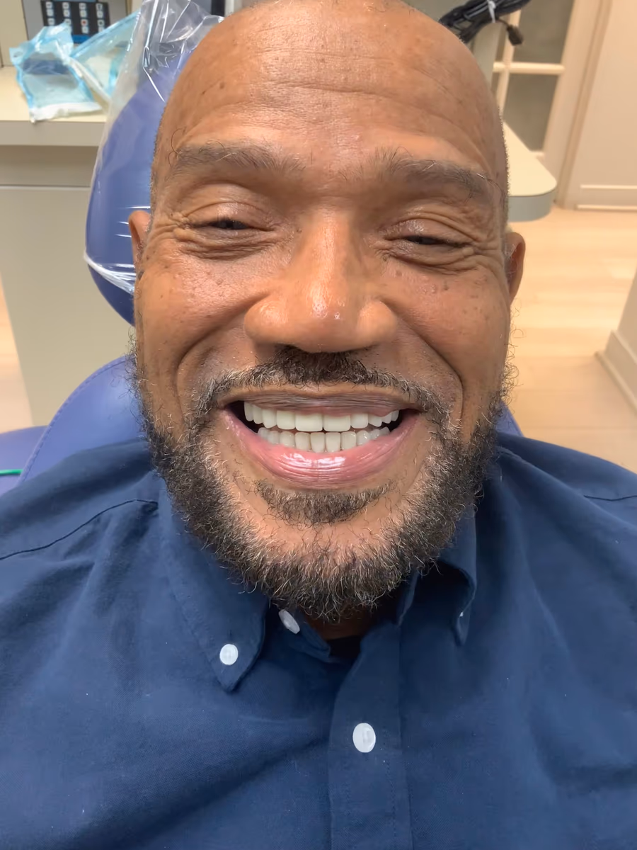 A White32 Dental patient smiling after a full mouth reconstruction